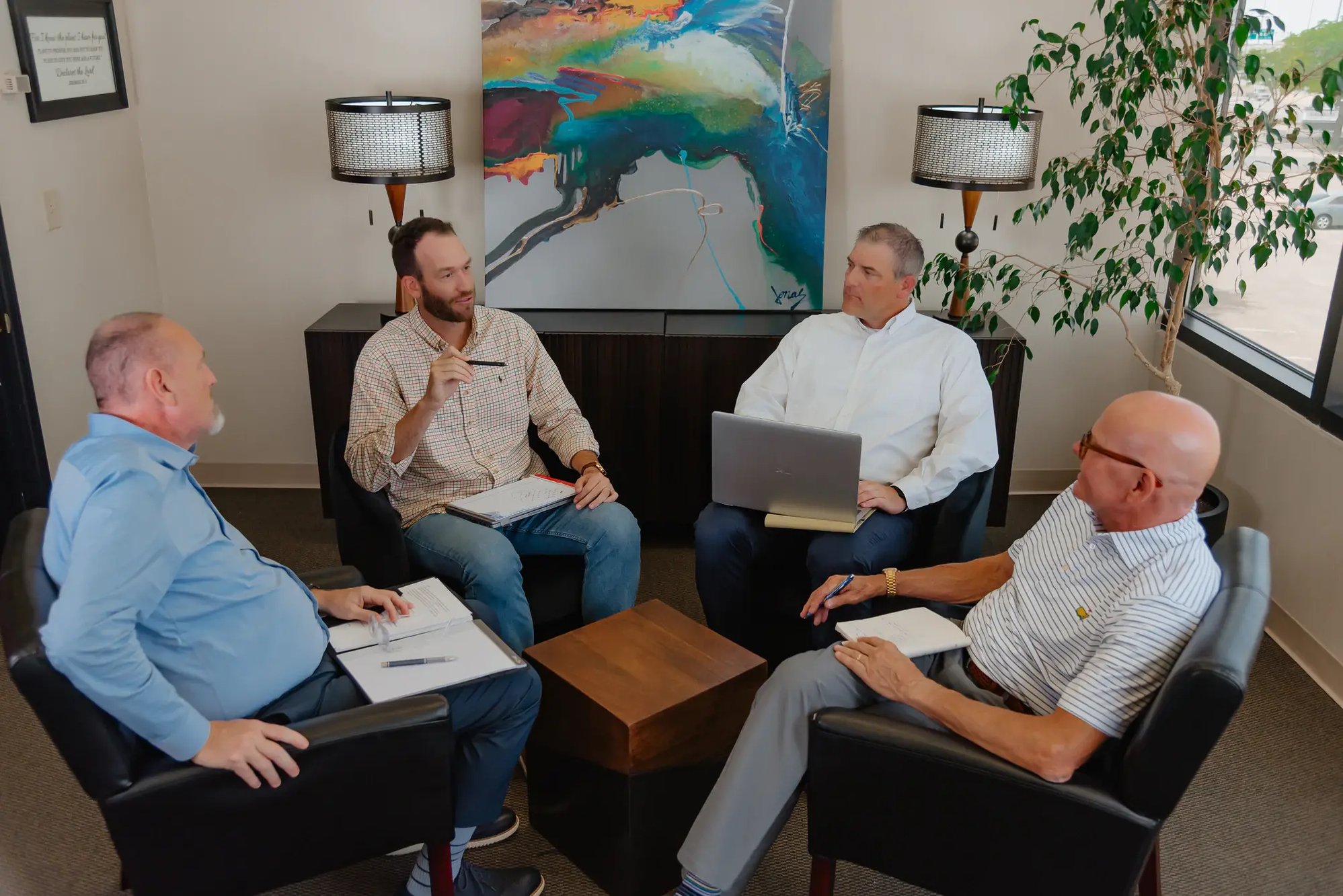 FUNDVIEW team collaborating in a lounge meeting.